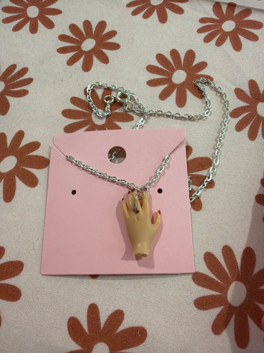 Doll hand necklace